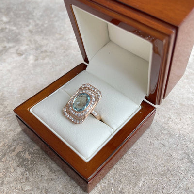 18CT rose gold Aquamarine and diamond ring