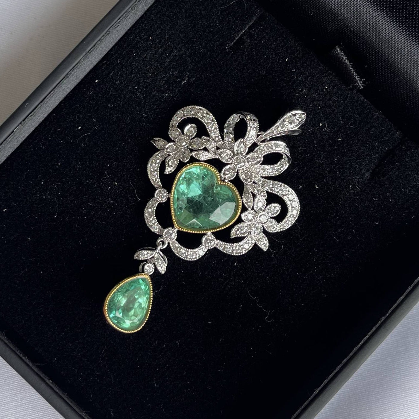 18CT white gold Colombian emerald and diamond pendant