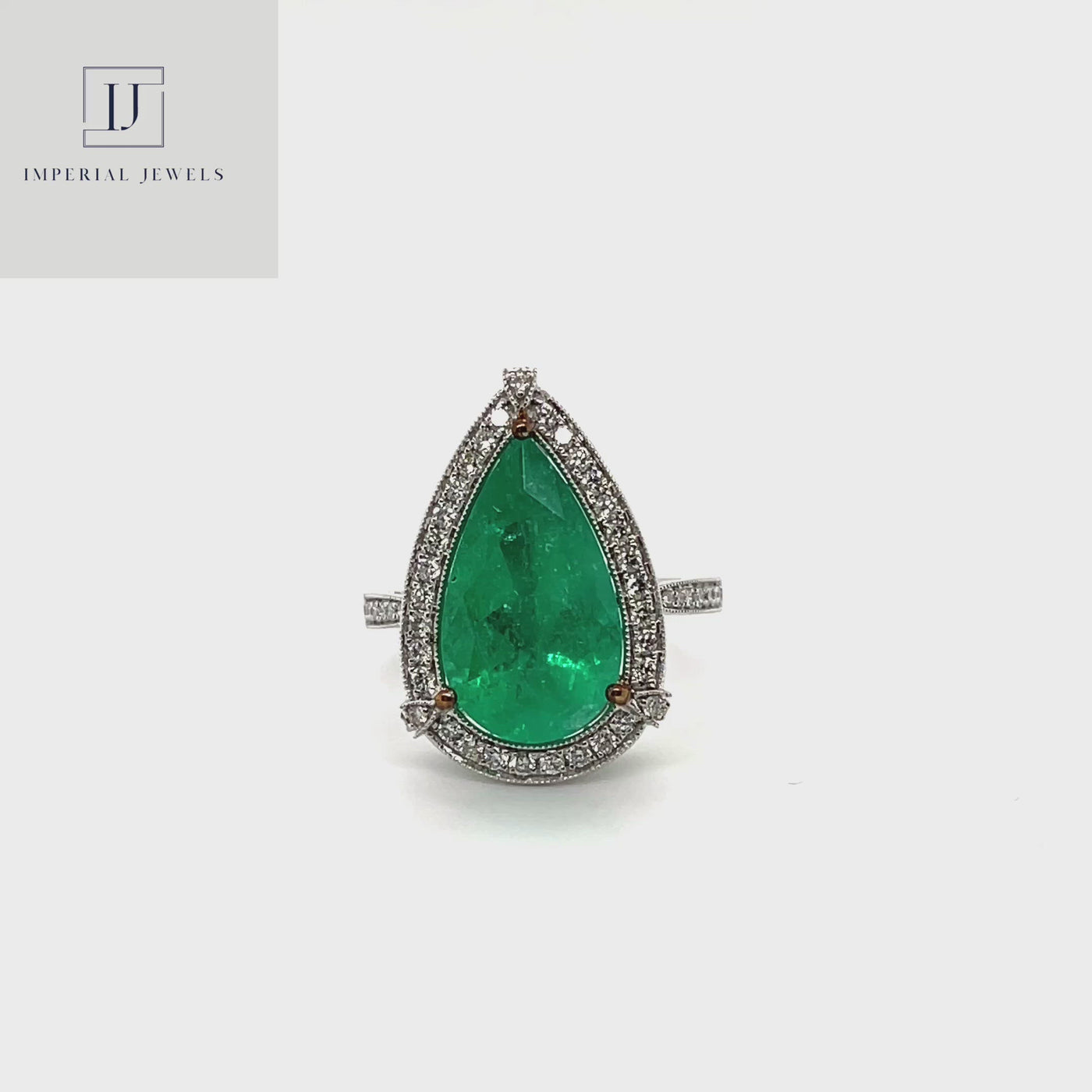 18CT white gold Colombian Pear emerald and diamond ring