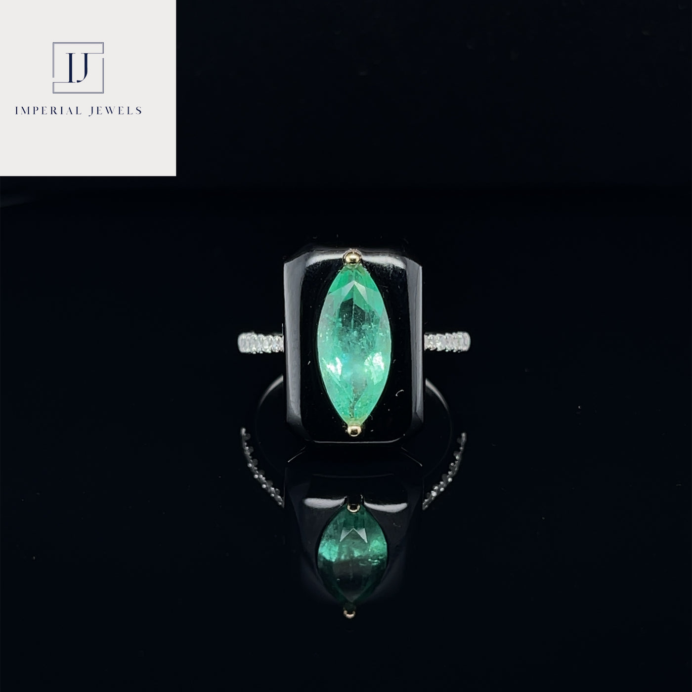 18CT white gold marquise colombian emerald, onyx and diamond ring