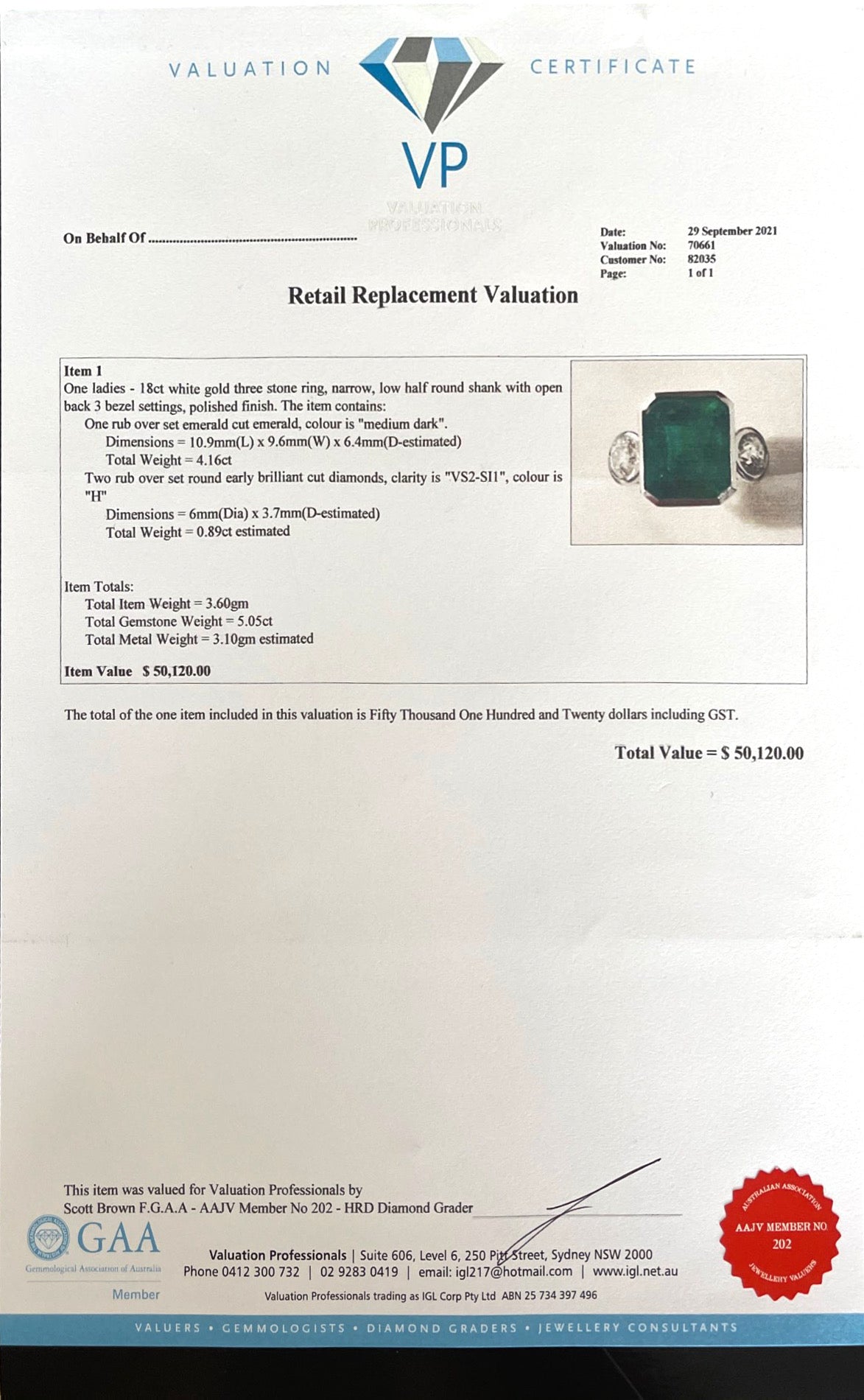18CT white gold emerald and diamond ring