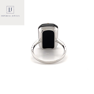 18CT white gold marquise colombian emerald, onyx and diamond ring