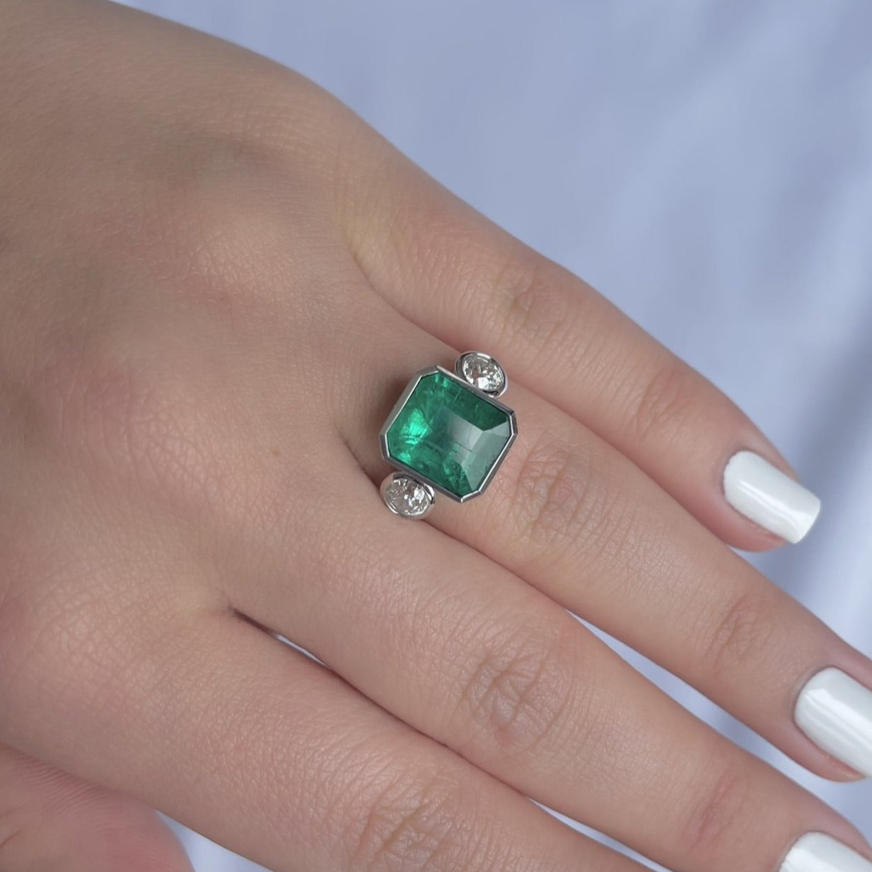 18CT white gold emerald and diamond ring