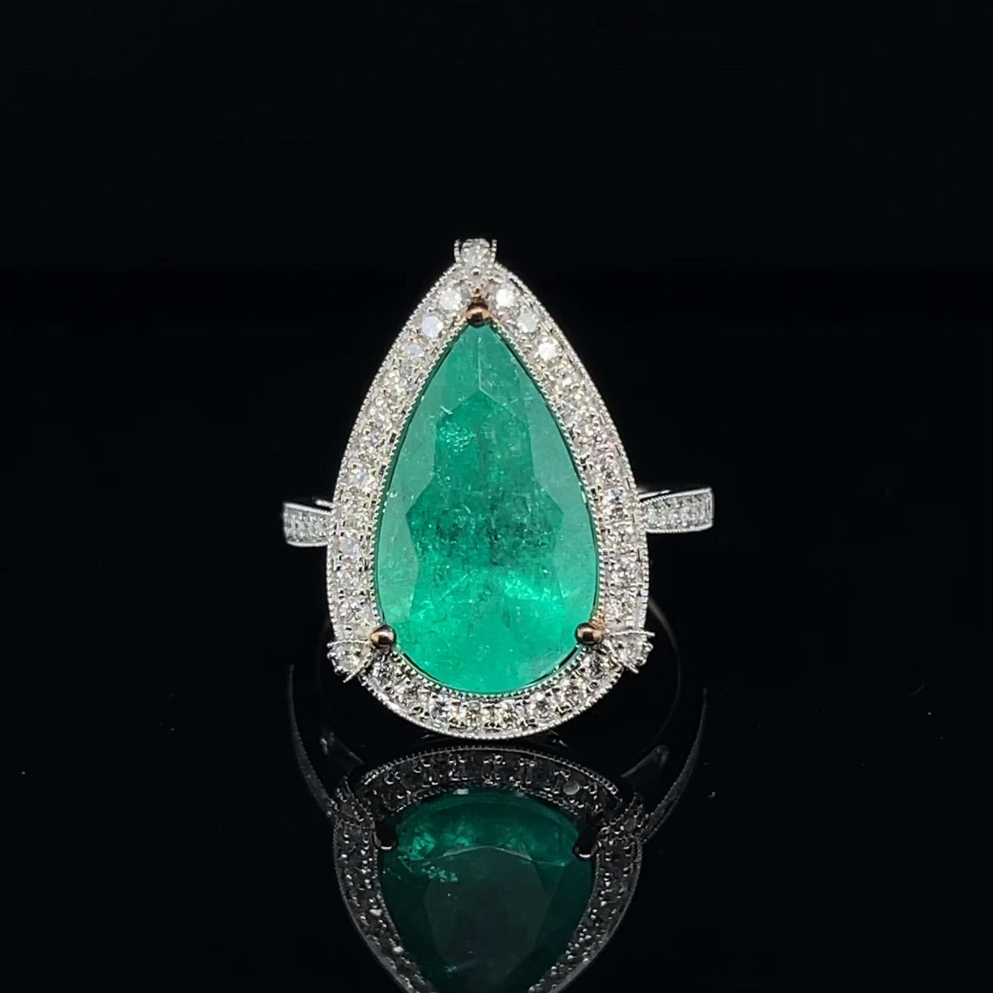 18CT white gold Colombian Pear emerald and diamond ring