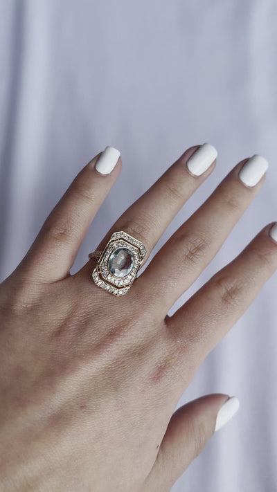 18CT rose gold Aquamarine and diamond ring