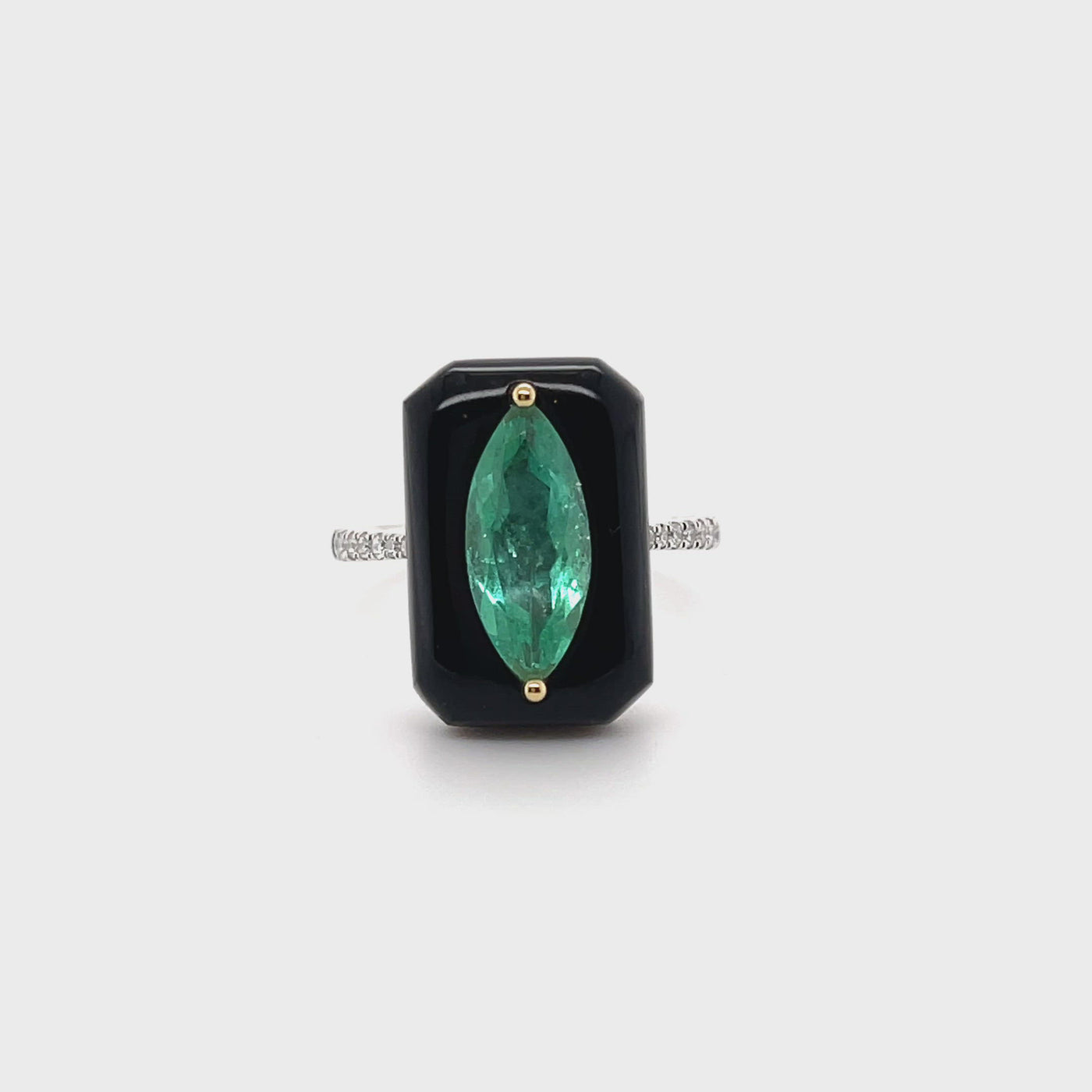 18CT white gold marquise colombian emerald, onyx and diamond ring