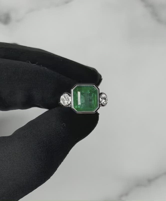 18CT White Gold Emerald and Diamond Ring